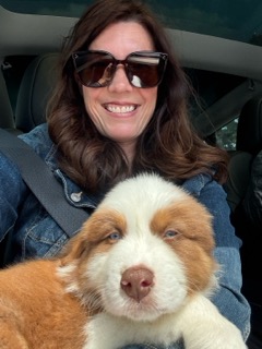 Katrina with a puppy — Paws in the Cabin flight nanny